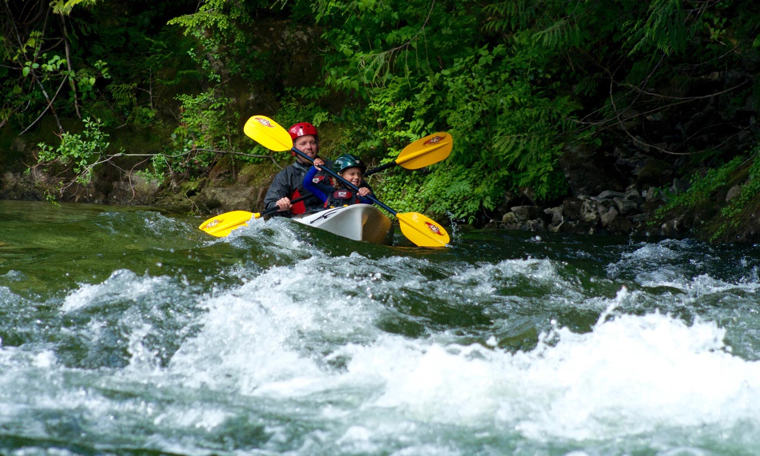 river kayaking dad and daughter