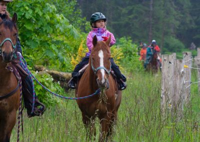 CWR Wrangler Leading Child on Horseback